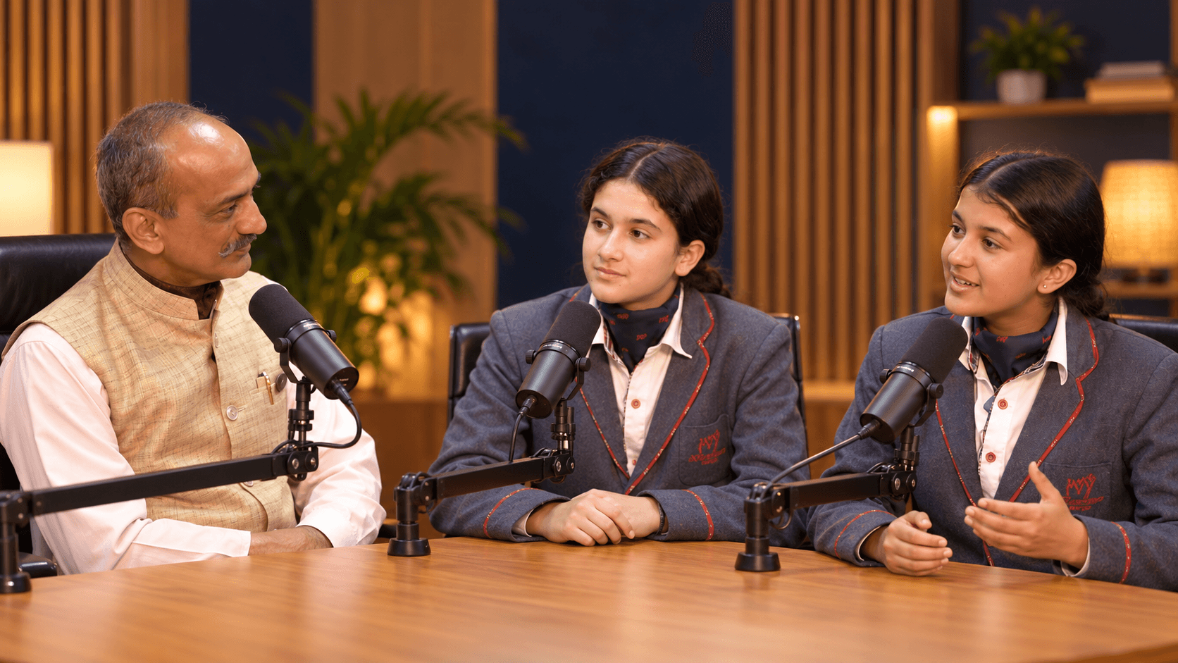 Students leading a recorded podcast conversation